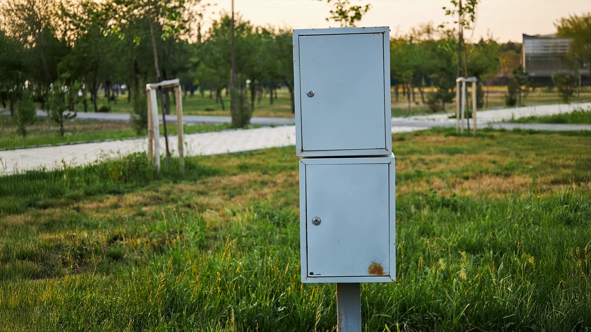 Outdoor network enclosure with fan ensuring stable temperature and airflow control.